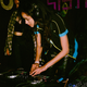 Dj ILa plays at a SISTASPIN-organized event.